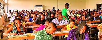 300/400 Level students having a pen on paper exam